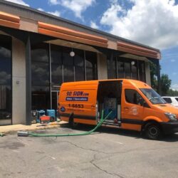 sewage cleanup van on job site