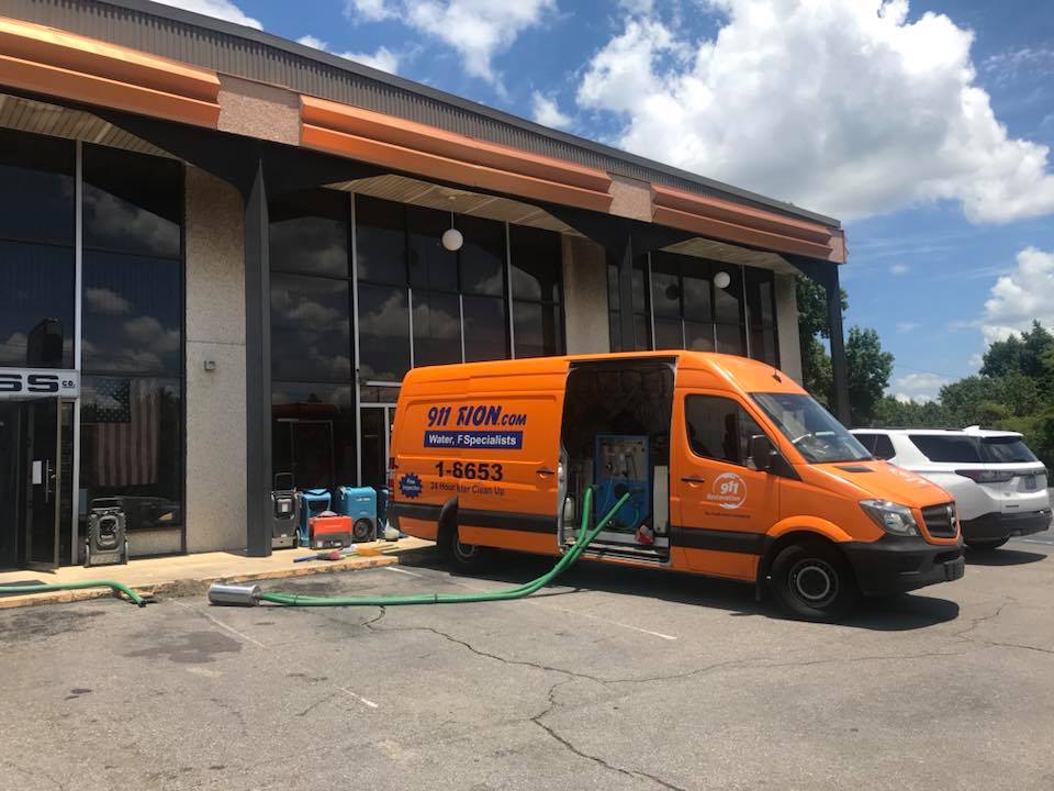 sewage cleanup van on job site